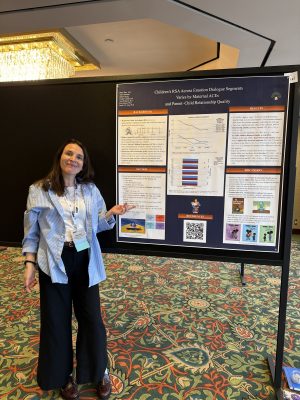 Graduate student Hilary presenting her poster at ISDP.